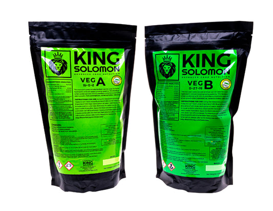 Two King Solomon Veg nutrient pouches side by side; Veg A and Veg B formulas in black resealable bags with bright green labels, part of the Rooted Intellect Veg and Clone Kit.