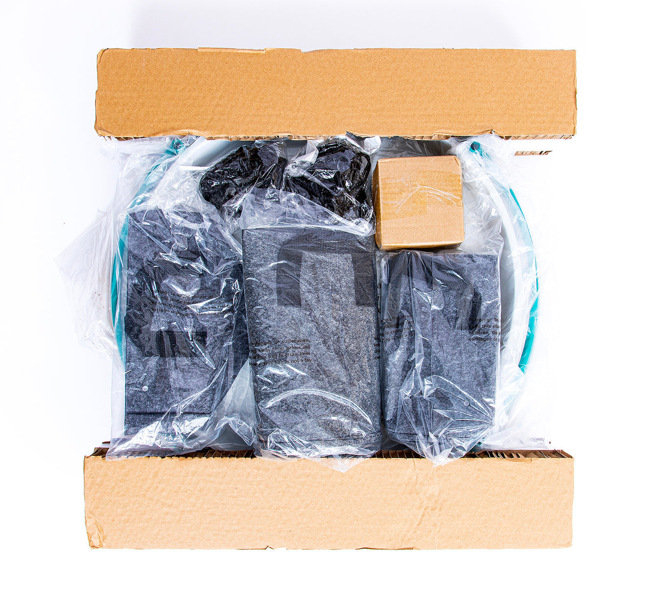 Bloom Carousel modular frame components and fabric grow bags packed inside a cardboard box
